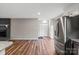 Bright living space featuring hardwood floors, stainless steel appliances, and an open floor plan at 118 Alfara Ln, Troutman, NC 28166