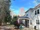 Manicured backyard with stone patio and covered porch area at 12217 Greymore Ct, Charlotte, NC 28277