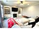 Inviting living room featuring a fireplace, built-in shelving, and large windows at 12217 Greymore Ct, Charlotte, NC 28277