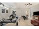 Well-lit basement with fitness equipment provides ample space for workouts and recreational activities at 126 Sisters Cove Ct, Mooresville, NC 28117