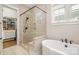 Contemporary bathroom featuring glass shower and walk-in closet with custom shelving at 126 Sisters Cove Ct, Mooresville, NC 28117