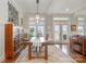 A lovely dining room with a wooden table, rug, and view to the outdoors at 126 Sisters Cove Ct, Mooresville, NC 28117