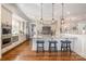 A bright, open kitchen features a large island with bar seating and stainless steel appliances at 126 Sisters Cove Ct, Mooresville, NC 28117