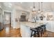 Modern kitchen with granite countertops, stainless steel appliances, and a center island with bar seating at 126 Sisters Cove Ct, Mooresville, NC 28117