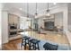 Gourmet kitchen features a large island with seating and modern pendant lighting at 126 Sisters Cove Ct, Mooresville, NC 28117