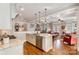 Open concept kitchen and living room with hardwood floors and white trim at 126 Sisters Cove Ct, Mooresville, NC 28117