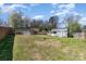 Backyard with a lawn and shed, blending outdoor storage with green space at 134 Cline St, Concord, NC 28027