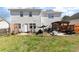 Backyard featuring a patio area and lush lawn, blending outdoor relaxation and green space at 134 Cline St, Concord, NC 28027