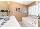 Bathroom features a bathtub, double sinks and unique decor at 134 Cline St, Concord, NC 28027