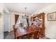 A cozy dining room featuring a wooden table and a cabinet at 134 Cline St, Concord, NC 28027