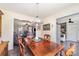 An inviting dining room showcasing a wooden table, and a view of the living room at 134 Cline St, Concord, NC 28027