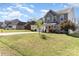 Suburban home with a front yard, driveway, and street view in a quiet neighborhood at 134 Cline St, Concord, NC 28027