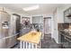 A modern kitchen featuring gray cabinets, stainless steel appliances, and an island at 134 Cline St, Concord, NC 28027