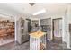 A modern kitchen featuring gray cabinets, stainless steel appliances, and dark tile flooring at 134 Cline St, Concord, NC 28027