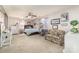 Spacious bedroom featuring a ceiling fan, printed sofa, and decoratively adorned walls at 134 Cline St, Concord, NC 28027