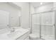 Clean, modern bathroom with a glass-enclosed shower, white vanity, and ample space at 138 Satchel Ct, Mooresville, NC 28115