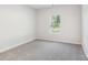 A neutral bedroom with plush carpeting, a window with blinds and natural light at 138 Satchel Ct, Mooresville, NC 28115