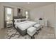 Stylishly staged bedroom with a plush bed, side tables, and elegant decor at 138 Satchel Ct, Mooresville, NC 28115