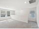 A carpeted bonus room with neutral colors, large window, and recessed lights, perfect for relaxation at 138 Satchel Ct, Mooresville, NC 28115