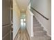 Inviting entryway with hardwood floors and a staircase leading to the upper level at 138 Satchel Ct, Mooresville, NC 28115