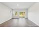 An airy living room with hardwood floors and sliding glass doors that provide ample natural light at 138 Satchel Ct, Mooresville, NC 28115