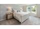 Serene bedroom with neutral tones, a comfortable bed, and a bedside table at 142 Shepherds Landing Dr, Mooresville, NC 28115