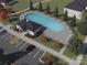 Aerial view of the community pool, surrounded by lounge chairs, parking and landscaping at 142 Shepherds Landing Dr, Mooresville, NC 28115