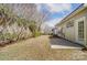 Exterior view showing the backyard, patio, and trees at 16729 Timber Crossing Rd, Charlotte, NC 28213