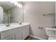 Bright bathroom with dual sinks, spacious countertops, and modern fixtures offers comfortable living at 16729 Timber Crossing Rd, Charlotte, NC 28213