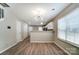 Spacious dining area featuring wood-look floors and natural light at 16729 Timber Crossing Rd, Charlotte, NC 28213