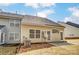 View of the home's exterior with patio and air conditioner at 16729 Timber Crossing Rd, Charlotte, NC 28213