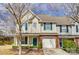 Exterior of the home features vinyl siding and an attached garage at 16729 Timber Crossing Rd, Charlotte, NC 28213