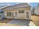 Backyard view showcasing the patio and siding at 16729 Timber Crossing Rd, Charlotte, NC 28213