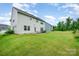 Large backyard featuring a patio with a grill, providing plenty of room for activities and relaxation at 16839 Cozy Cove Rd, Charlotte, NC 28278