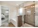 Bathroom with a walk-in shower and separate soaking tub at 16839 Cozy Cove Rd, Charlotte, NC 28278