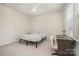 Cozy bedroom with neutral tones, a double bed, and a work desk at 16839 Cozy Cove Rd, Charlotte, NC 28278