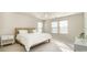 Bright bedroom with neutral tones, carpet floors, and multiple windows providing natural light at 16839 Cozy Cove Rd, Charlotte, NC 28278