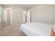 Bedroom with two closets and an adjacent door at 16839 Cozy Cove Rd, Charlotte, NC 28278