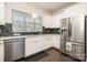 Updated kitchen with modern appliances and a view from the window at 16839 Cozy Cove Rd, Charlotte, NC 28278