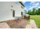 Outdoor patio with dining area, built-in grill, and easy access to a spacious backyard at 16839 Cozy Cove Rd, Charlotte, NC 28278
