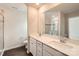 Modern bathroom with double vanity, quartz countertop, and a tiled shower at 1816 Otter Perch Ln, Fort Mill, SC 29715