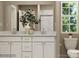 Bright bathroom featuring a double sink vanity, modern fixtures, and an elegant mirror at 1816 Otter Perch Ln, Fort Mill, SC 29715