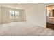 Bright and spacious bedroom with neutral carpet and a window at 1816 Otter Perch Ln, Fort Mill, SC 29715