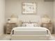 Neutral primary bedroom featuring a comfortable bed, coordinated lamps, and matching nightstands at 1816 Otter Perch Ln, Fort Mill, SC 29715
