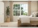 Bright bedroom featuring a wooden bed frame, neutral walls, and a window with natural light at 1816 Otter Perch Ln, Fort Mill, SC 29715