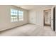 Neutral bedroom with carpet, a window, and a closet at 1816 Otter Perch Ln, Fort Mill, SC 29715