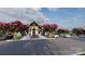 Exterior of clubhouse with flowering trees in the landscape and ample parking spaces at 1816 Otter Perch Ln, Fort Mill, SC 29715