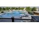 Expansive outdoor pool and lounge area with ample seating and shaded spots on a sunny day at 1816 Otter Perch Ln, Fort Mill, SC 29715