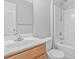 Bright bathroom with modern vanity, toilet, and shower-tub combo at 1911 Kingstree Dr, Monroe, NC 28112