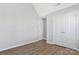 Bedroom featuring wood-look vinyl floors and a double-door closet at 1911 Kingstree Dr, Monroe, NC 28112